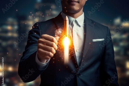 A man dressed in a suit holding a lighter in his hand. This image can be used to depict elegance, power, or a sophisticated event.