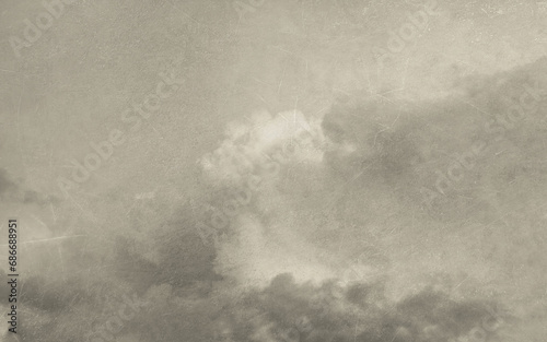 Vintage background with clouds and old paper texture. Handmade textured backdrop. Aged wallpaper for card. Monochrome poster for design interior. Grunge template.