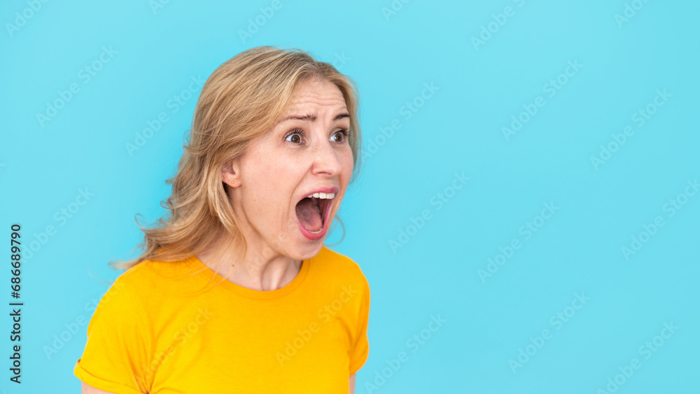 Furious woman with crazy angry face screaming with open mouth Furious woman with crazy angry face screaming with open mouth