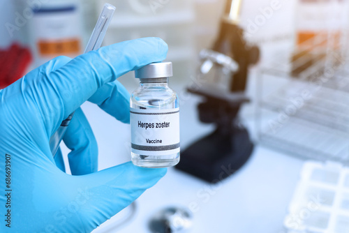 Fototapeta Naklejka Na Ścianę i Meble -  Herpes zoster vaccine in a vial, immunization and treatment of infection