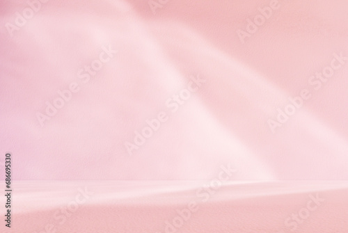 Empty pink colour room studio with sunlight effect shadow on the floor and wall for product presentation. Minimal backdrop design. Cosmetic, beauty and fashion showroom. Summer background mock up. photo