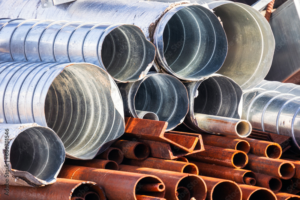 Pile of used metal tubes for air ventilation and water systems Pile of used metal tubes for air ventilation and water systems