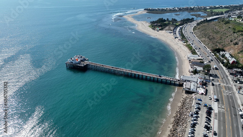 Malibu Pier At Los Angeles In California United States. Coast City Landscape. Beach Background. Malibu Pier At Los Angeles In California United States.  photo