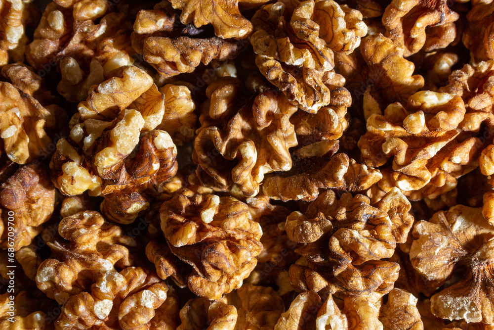 Scattered Shelled Walnuts. Background from Walnut. Natural High-Calorie Snacks Scattered Shelled Walnuts. Background from Walnut. Natural High-Calorie Snacks