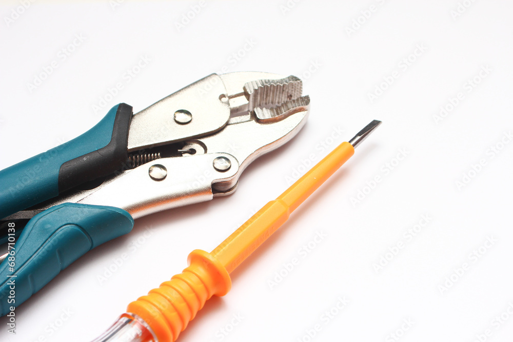 Tools for pliers on a white background, close-up. Tools for pliers on a white background, close-up.