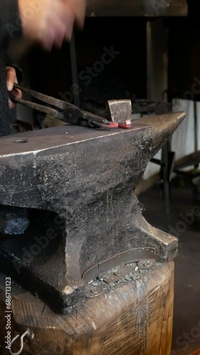 Traditional ironsmith forging horseshoe photo