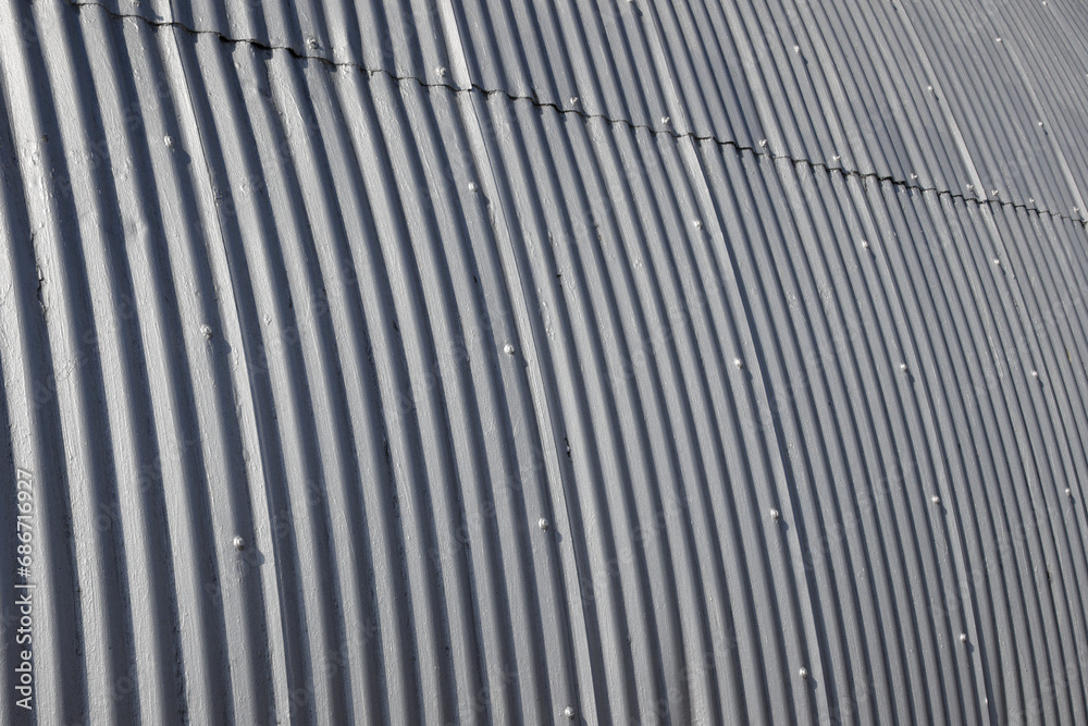 Fototapeta premium Corrugated galvanized steel panels on the exterior of a building. For background, wallpaper or clipping mask.