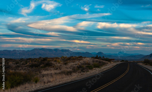 Pink clouds over the road in the stone desert near Santa Elena Canyon in Big Bend NP