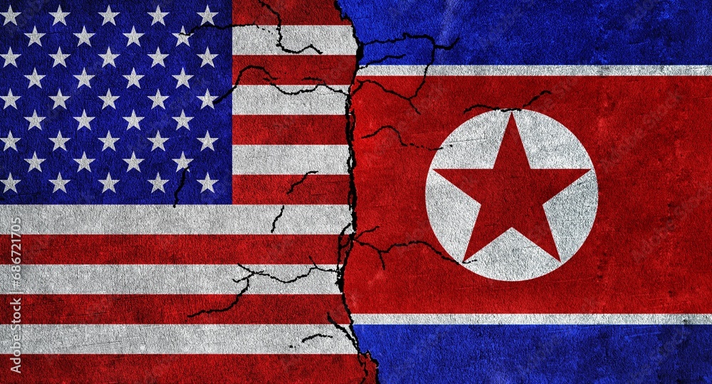 Obraz premium USA and North Korea flag together on a cracked wall. North Korea and United States of America diplomatic relations