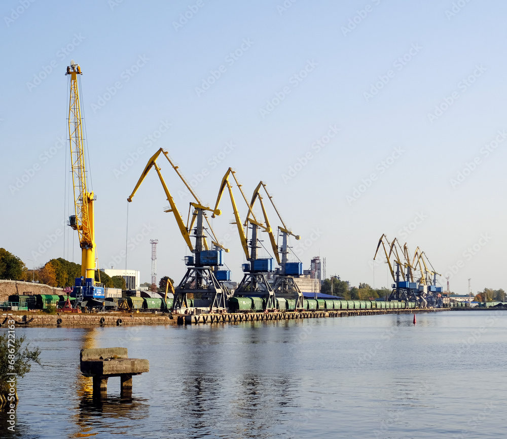 Small freight sea port with cranes and containers in the Bay of Vyborg, Russia