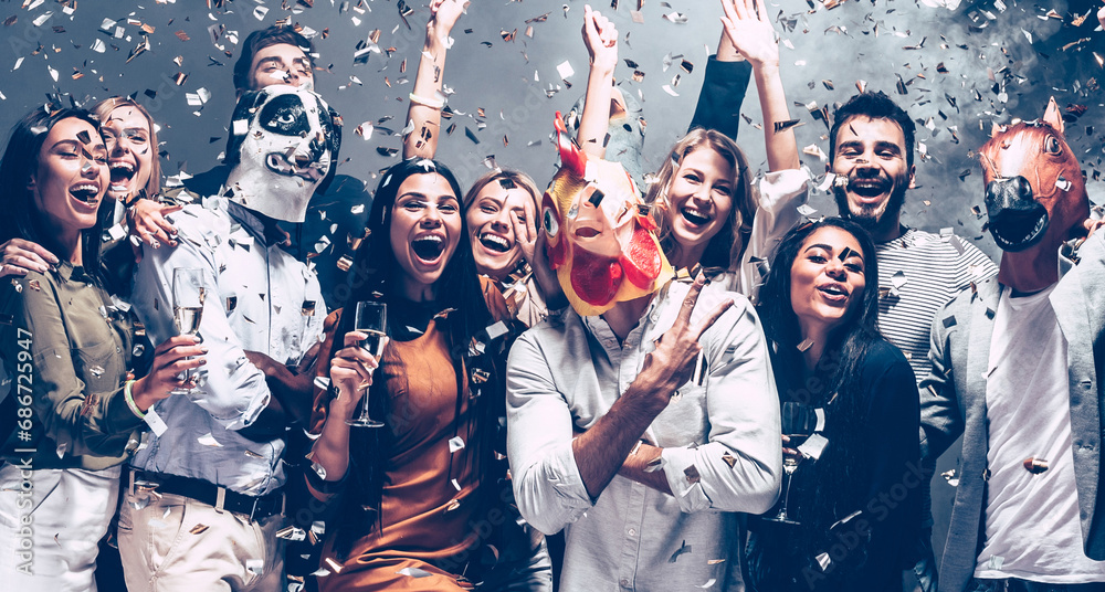 © gstockstudio - Group of playful young people in animal masks having fun in night club together while confetti flying around © gstockstudio - Group of playful young people in animal masks having fun in night club together while confetti flying around