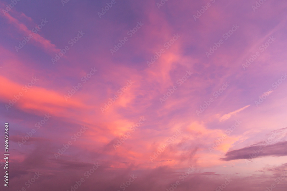 Epic Dramatic soft sunrise, sunset pink purple violet orange sky with cirrus clouds in sunlight background texture