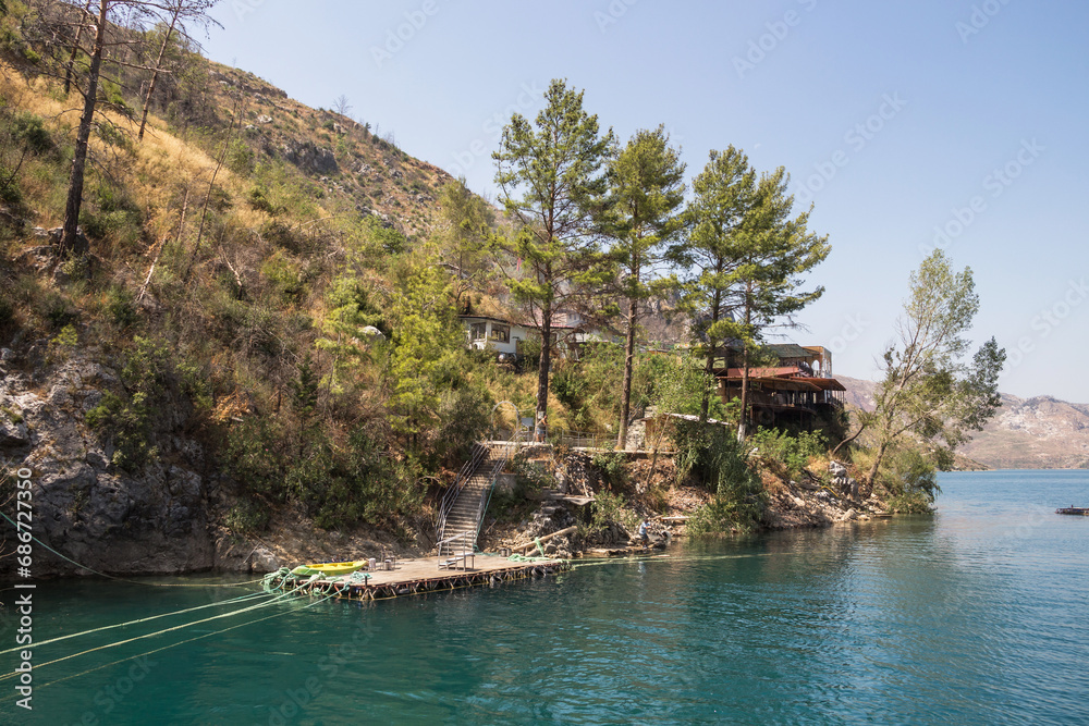 Restaurant on a hill in Green Canyon. Green Canyon in Turkey, the city of Manavgat. Artificial lake-reservoir. Excursions to the Green Canyon.