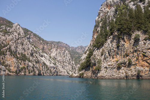 Fototapeta Naklejka Na Ścianę i Meble -  Green Canyon in Turkey, the city of Manavgat. Taurus Mountains and an artificial lake-reservoir. Excursions to Green Canyon