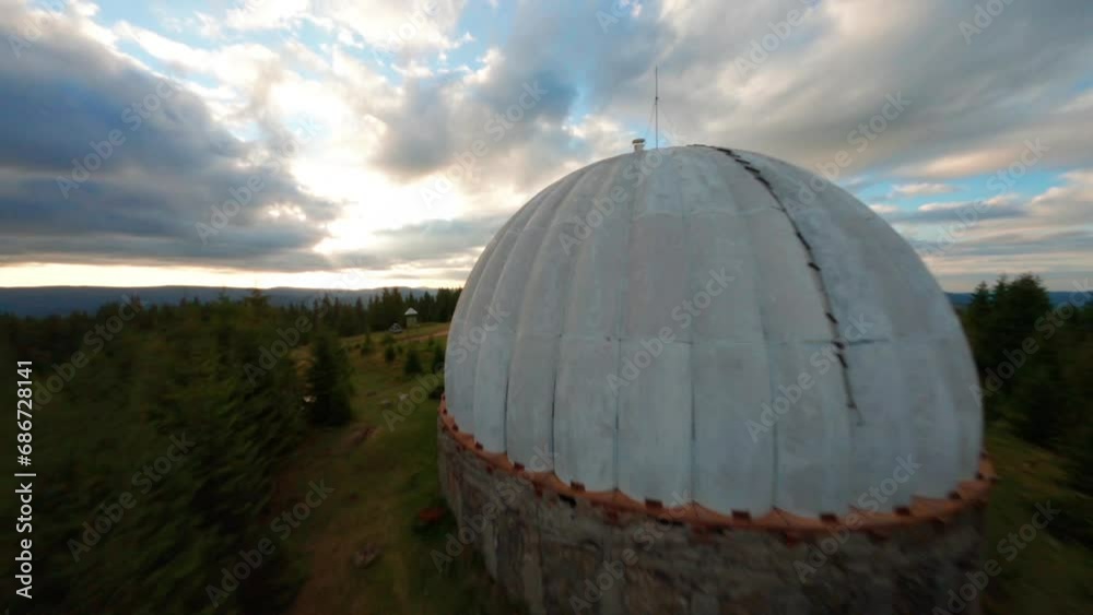 FPV, Abandoned radar station Pamir in Carpathian mountains, research station on top of the mountain in the Carpathians in Ukraine. large white balloons designs in the mountains among the fir trees FPV, Abandoned radar station Pamir in Carpathian mountains, research station on top of the mountain in the Carpathians in Ukraine. large white balloons designs in the mountains among the fir trees