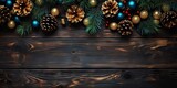 Rustic elegance. Festive christmas composition with frame branches and shiny ornaments. Vintage charm. Celebrating xmas with wooden table setting adorned by pine branches and golden decorations
