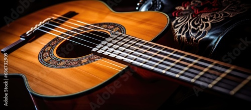 Close up of an acoustic guitar played by a professional musician, copy space background