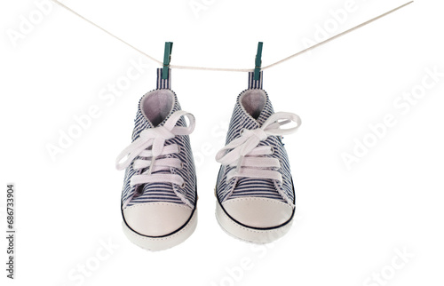 baby shoes hanging, concept for new born card photo