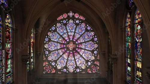 Intricate rose window with biblical imagery.