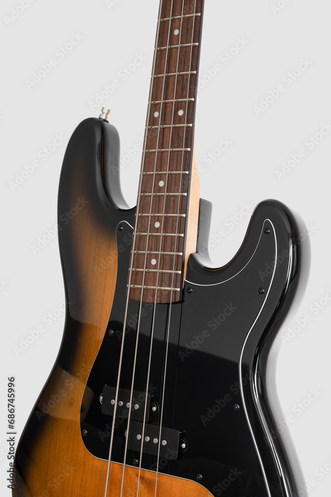 Obraz premium Brown bass guitar on white background