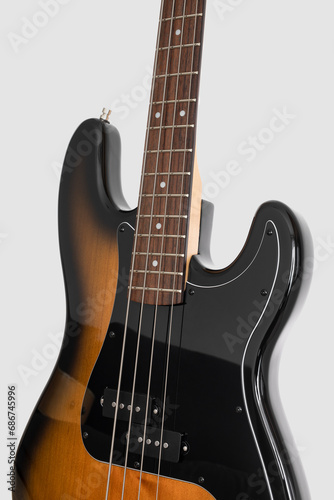 Brown bass guitar on white background