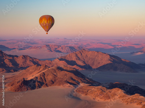 Early morning balloon ride over the sand and mountains in Namib-Naukluft Park; Sossusvlei, Namibia photo