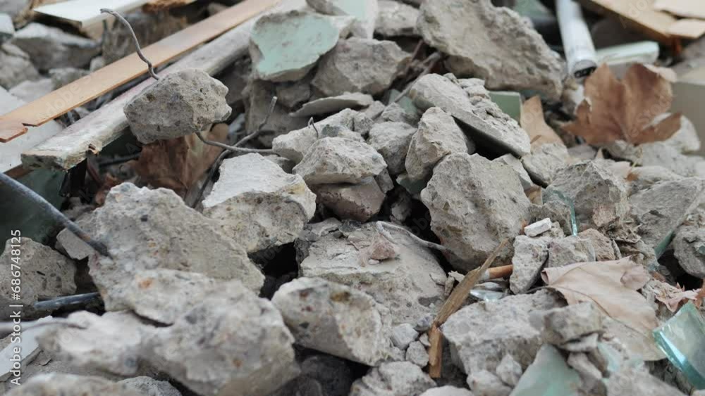 Garbage and a pile of construction debris in the yard of a house on the city street in Spain Barcelona. Garbage and a pile of construction debris in the yard of a house on the city street in Spain Barcelona.