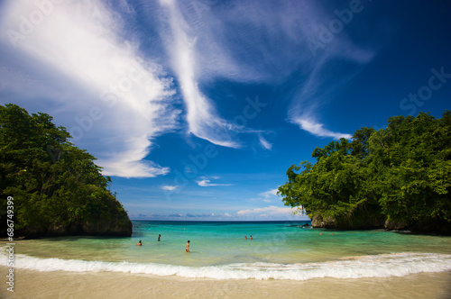 People enjoying a swim at Frenchman's Cove in Tobago; Port Antonio, Jamaica