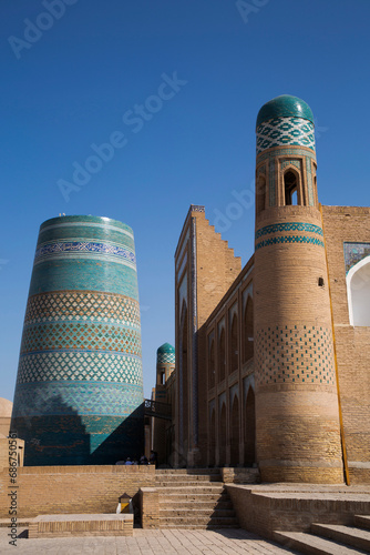 Kalta-minor Minaret (left), Muhammad Amin Khan Madrasah (Orient Star Hotel) (right), Itchan Kala; Khiva, Uzbekistan photo