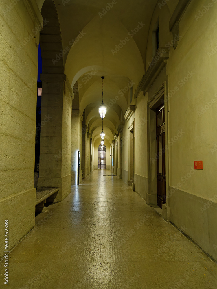 Fototapeta premium Wide angle night view of Lyon's Hôtel-Dieu, renovated and repurposed hospital, monumental corridor, Lyon, France