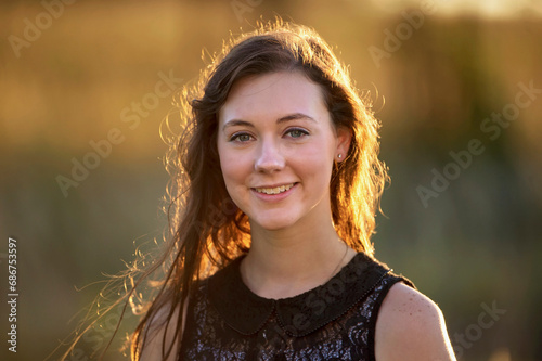 Portrait of a teenage girl in warm sunlight; Dunbar, Nebraska, United States of America photo