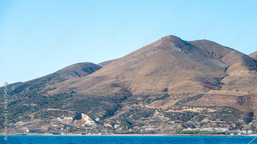 Panoramic view of Gokceada coast from the deck of passenger ship in Kuzu port Gokceada island. Imbrosisland, Çanakkale, Turkey