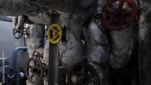 Valve hand wheels on steam pipe system