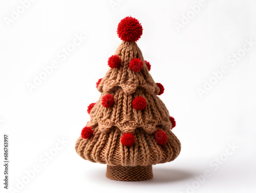 Colourful Christmas tree made of wool knitted clothes on a white background