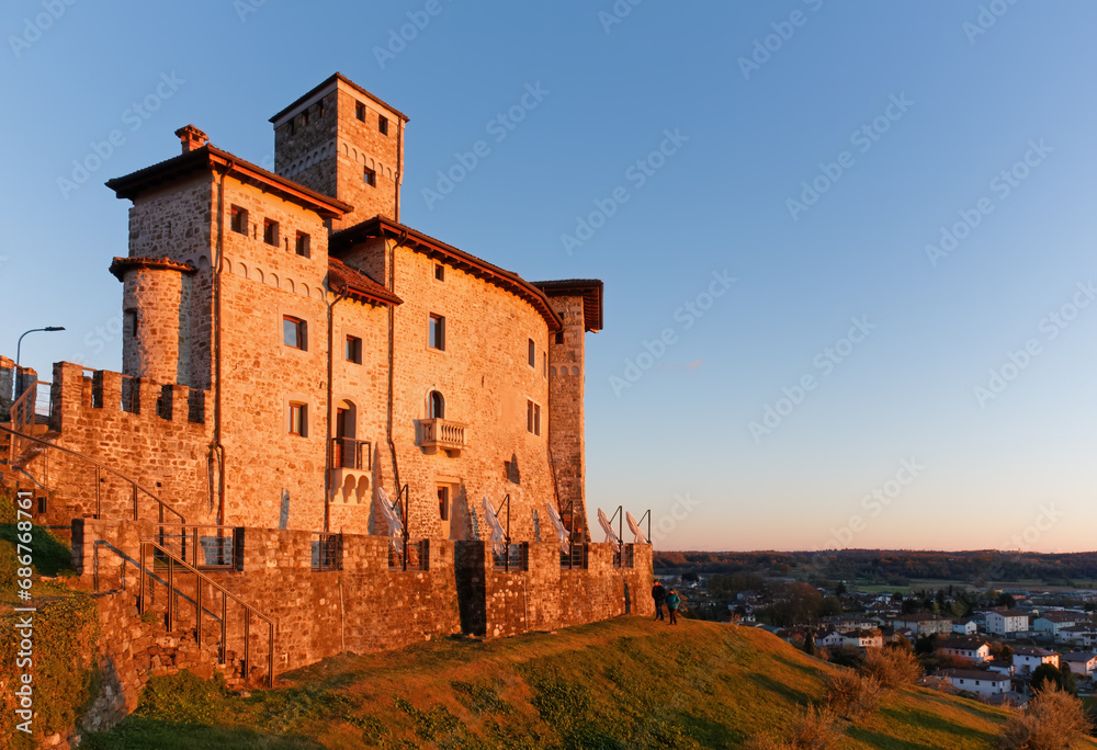 Artegna castle, in Friuli region, Italy, in the sunset light, on the hill above the town