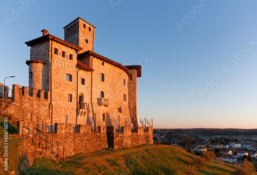 Artegna castle, in Friuli region, Italy, in the sunset light, on the hill above the town photo