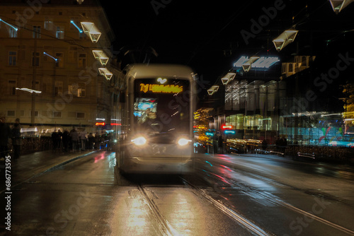 Night moving Trolley tram in graz austria tracks and cables in winter season