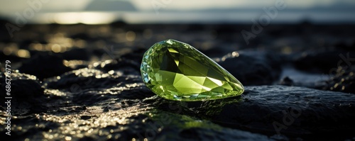 Beautiful shinning green diamond on the black background. photo