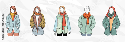 Winterzauber: Frauen in Stilvollen Winterjacken und Schals photo