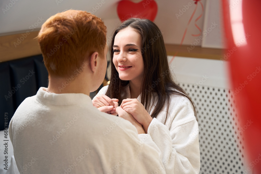 Fototapeta premium Romantic couple spending time together in contemporary apartment