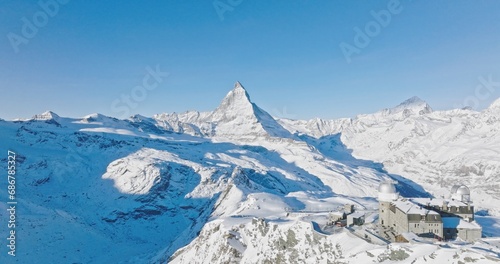 Panoramic view at Gornergrat with Matterhorn view during winter in Switzerland. Majestic mountain peaks iconic famous zermatt travel ski resort in the alps. Wonderful inspiring nature landscape.