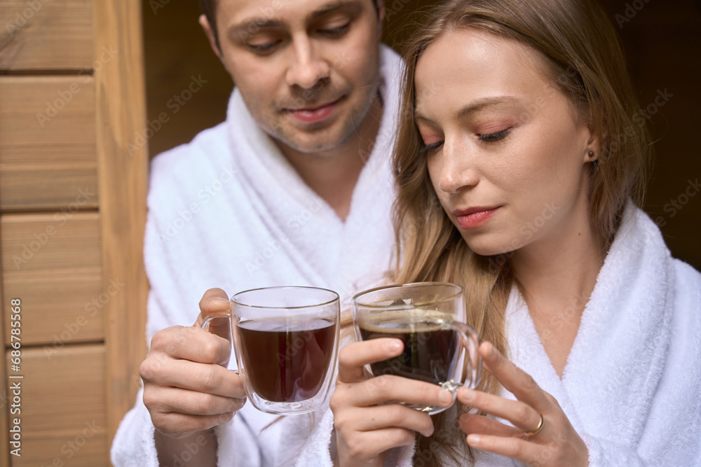 Married man and woman drinking hot morning beverage Married man and woman drinking hot morning beverage