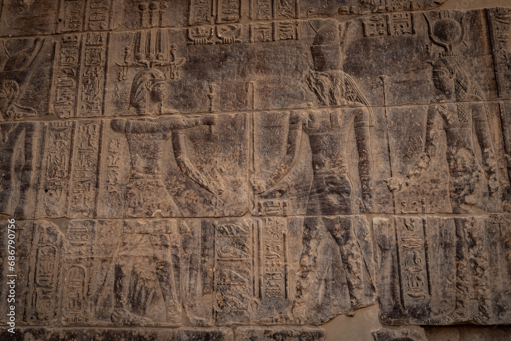 Obraz premium Stone wall carving at Philae temple in Aswan Upper Egypt