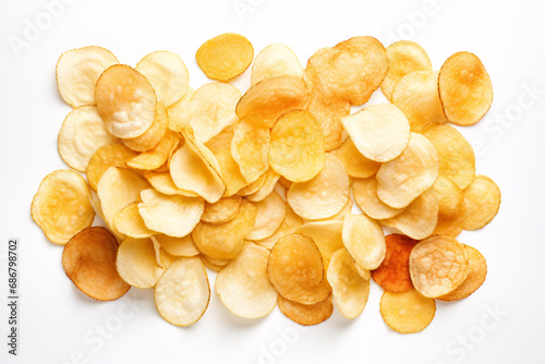 An accumulation of differing salted crisps isolated on a white color palette, seen from above. photo