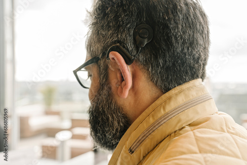 Profile of a man with cochlear implant photo