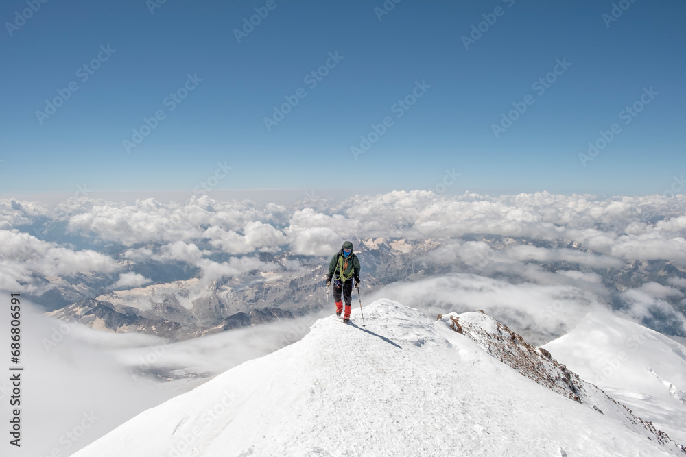 Russia, Upper Baksan Valley, Caucasus, Mountaineer ascending Mount Elbrus