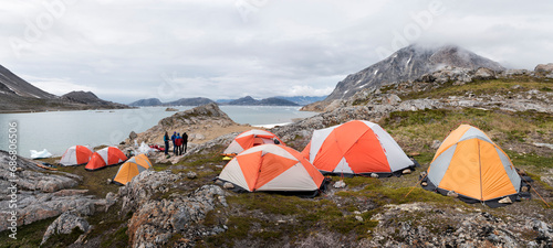 Greenland, Sermersooq, Kulusuk, Schweizerland Alps, group of people at camp photo