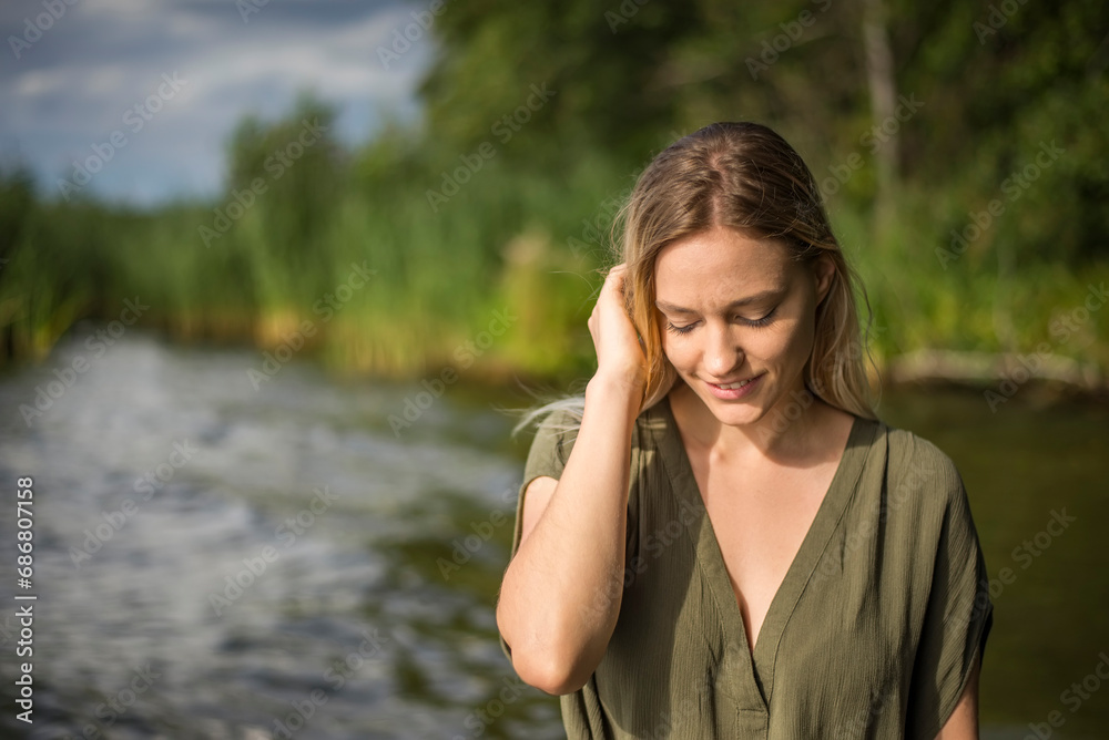 Woman standing at a lake