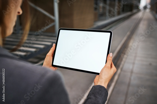 Close-up of businesswoman holding tablet in factory