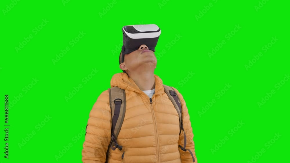 hiker with backpack and virtual reality goggles is immersed in a digital landscape on a green background.concept of fusion of technology and nature, offering a digital hiking experience. hiker with backpack and virtual reality goggles is immersed in a digital landscape on a green background.concept of fusion of technology and nature, offering a digital hiking experience.